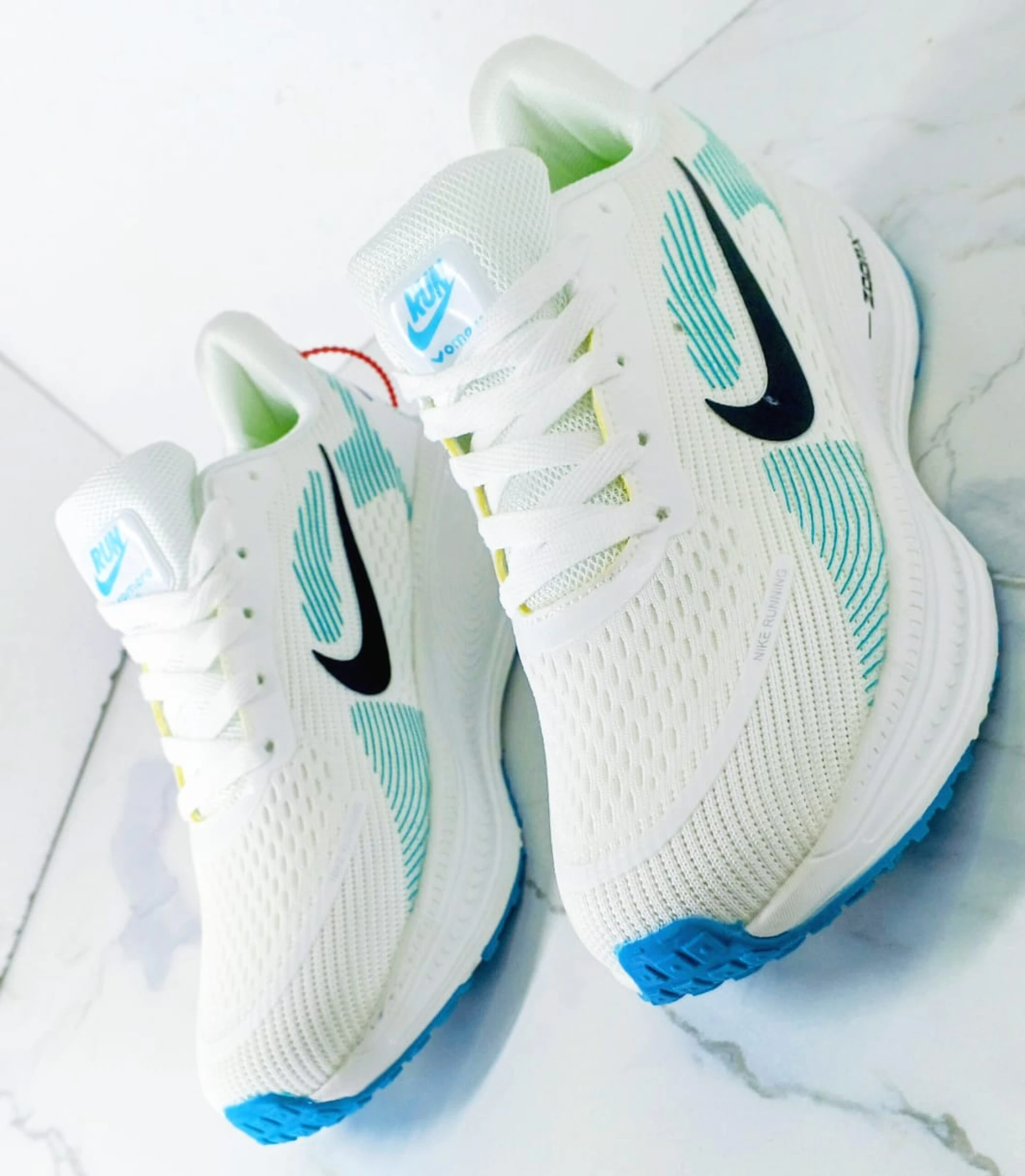 Nike Vomero 18 Zoomx White, with accents of Light Blue