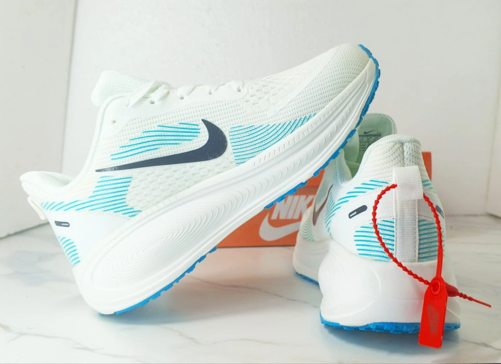 Nike Vomero 18 Zoomx White, with accents of Light Blue