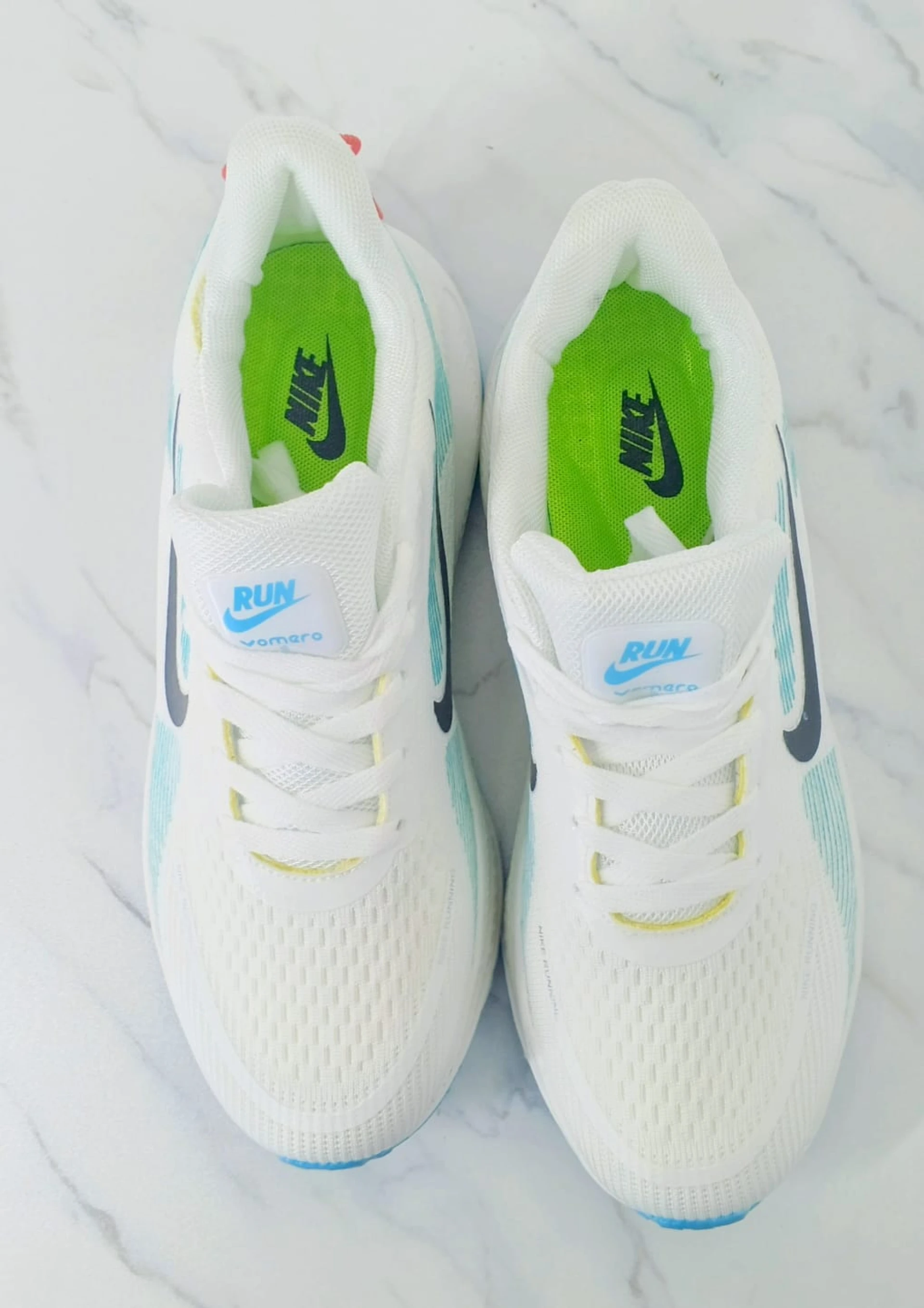 Nike Vomero 18 Zoomx White, with accents of Light Blue