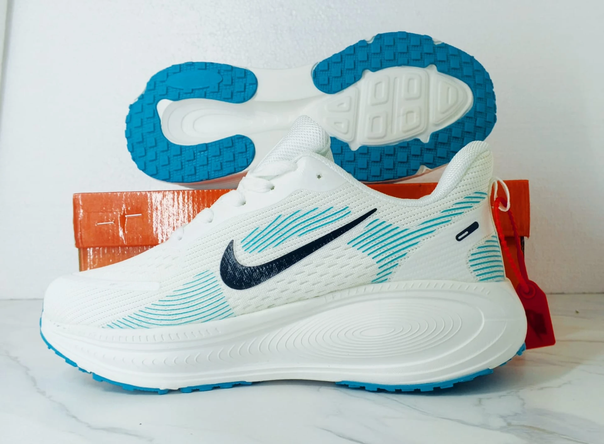 Nike Vomero 18 Zoomx White, with accents of Light Blue